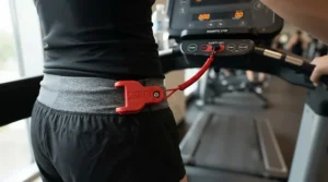 Detail shot of the emergency safety lanyard attached to a user on a treadmill for teenagers under $300.